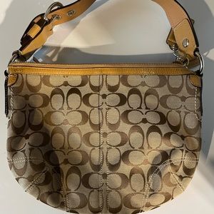 Tan Coach shoulder purse.